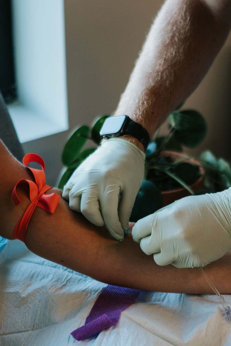 arm person wears white gloves clinic
