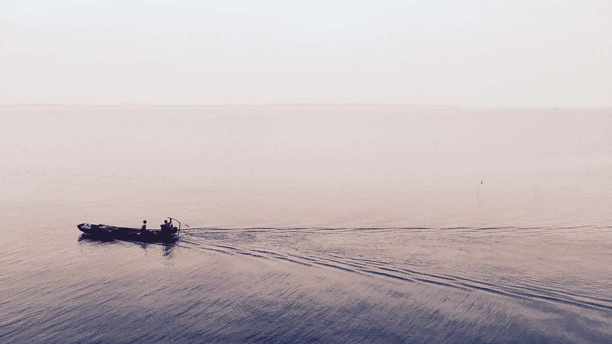 boat moving on body of water 