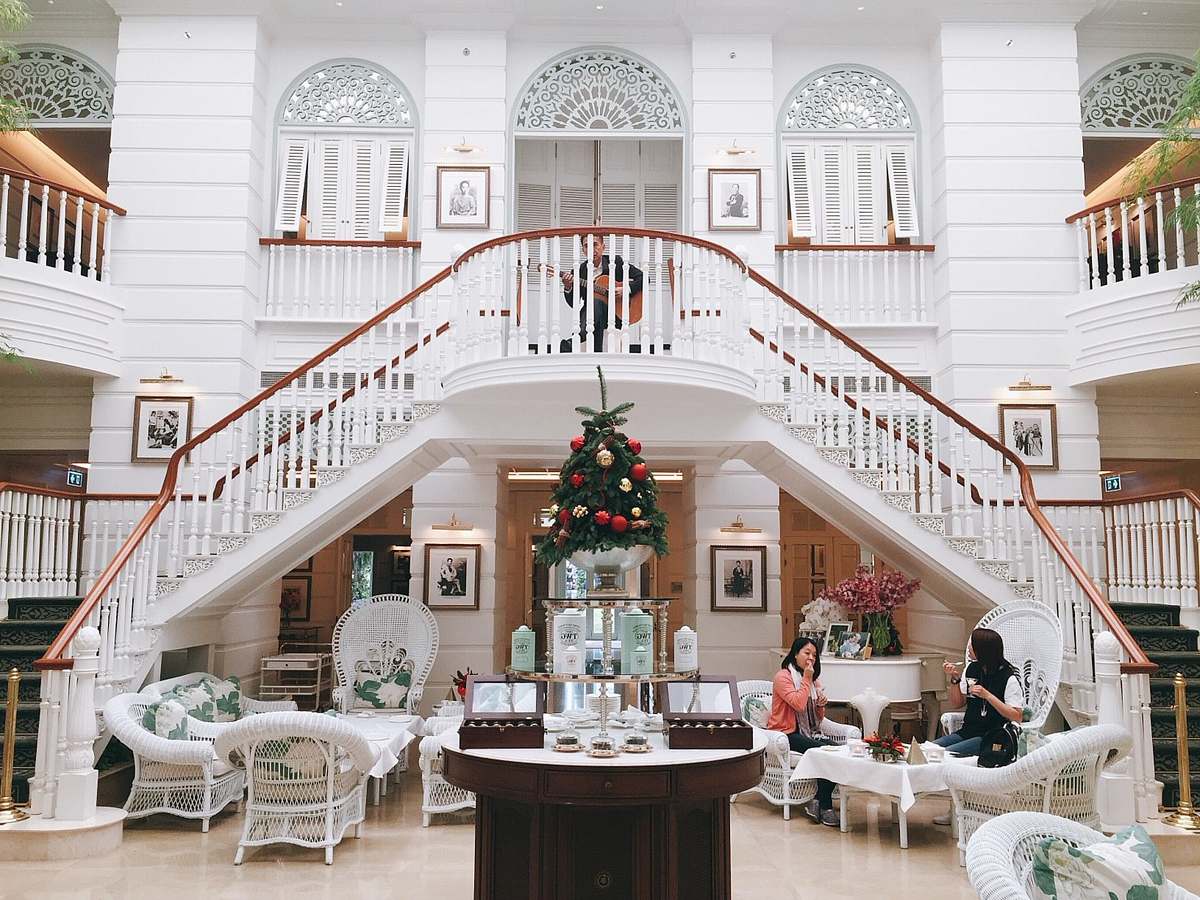  photo of house interior with two women sitting on chairs 