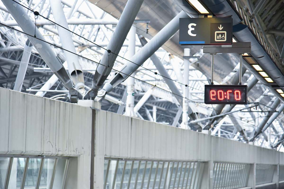 clock white concrete wall and 7:09 time sign