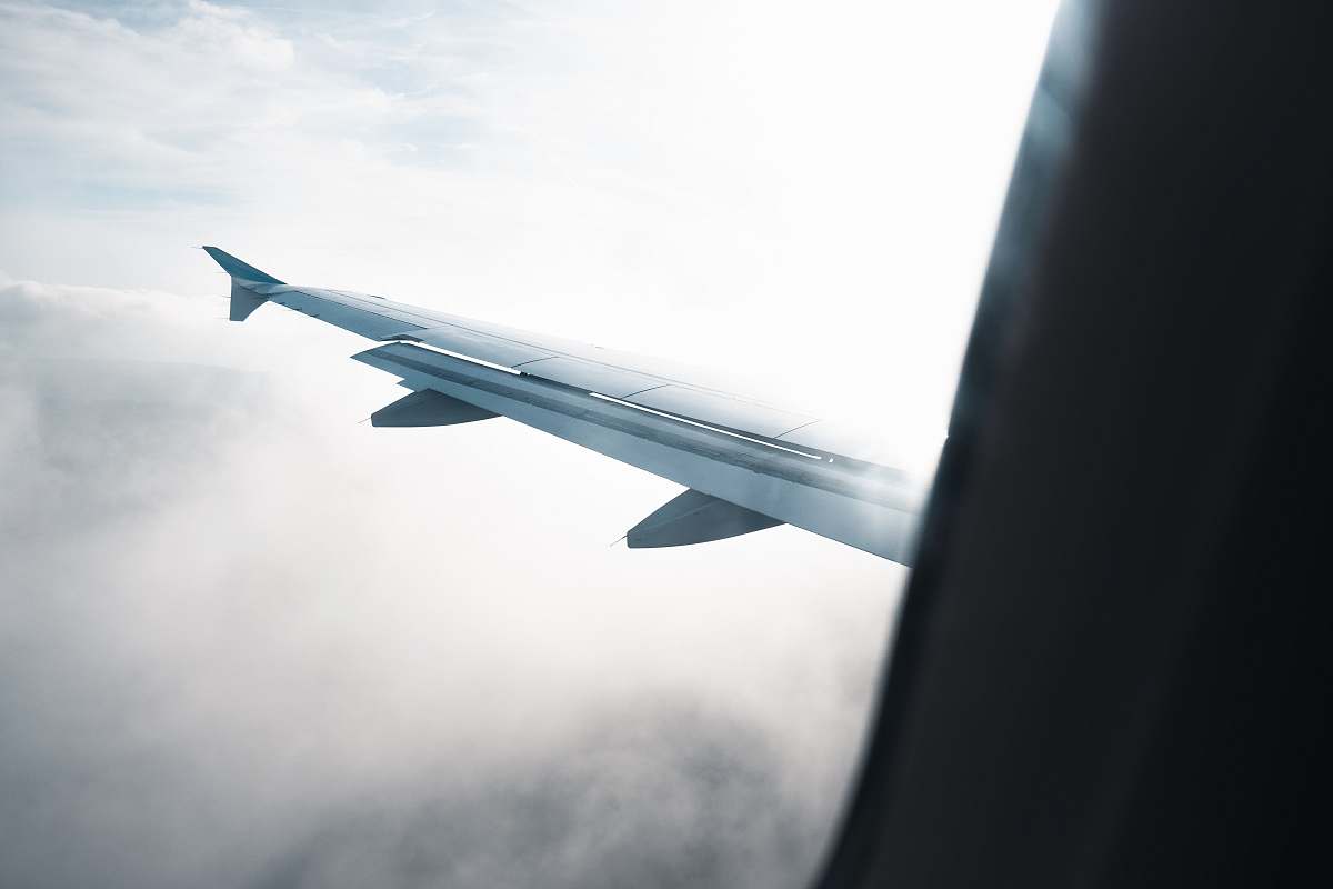 airplane flying white plane wings transportation