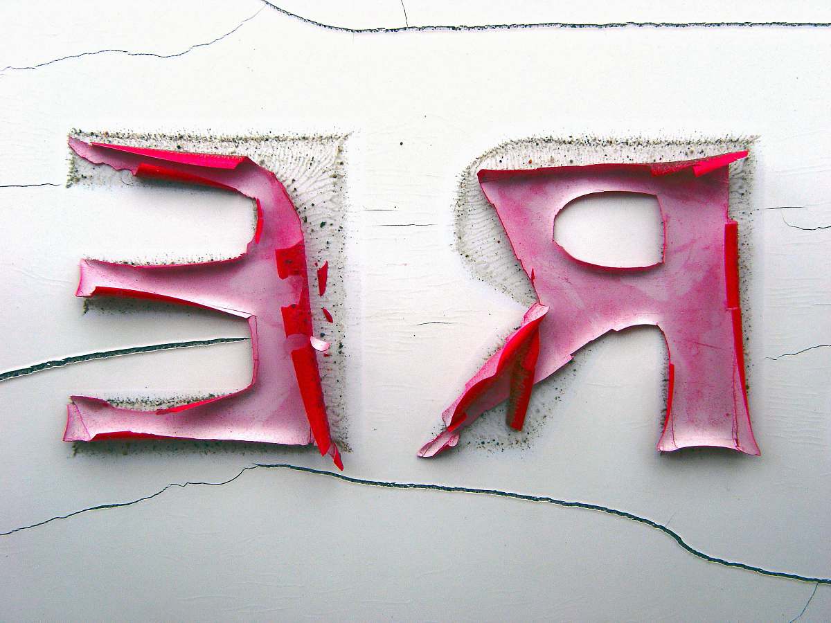 text closeup photo of a R and E stickers re