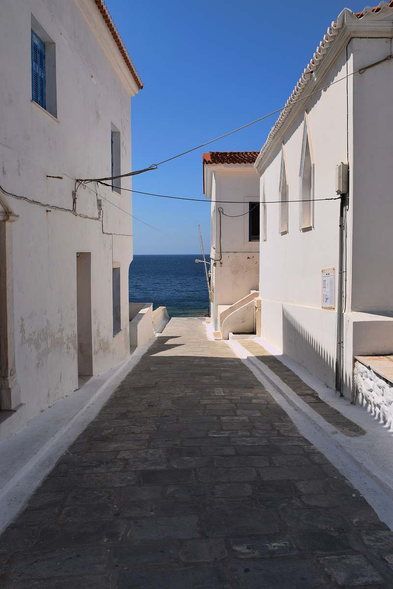 greece empty pathway with beige concrete house summer