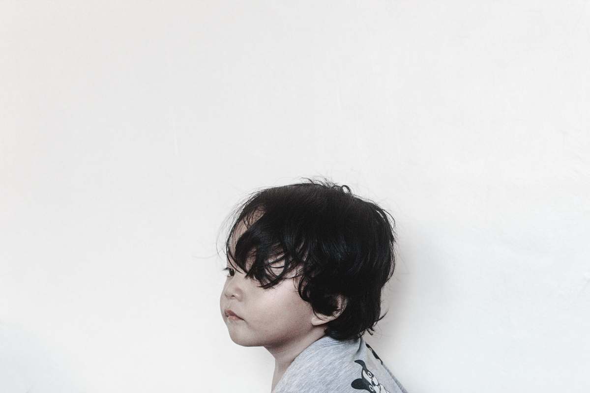 human baby wearing gray top person