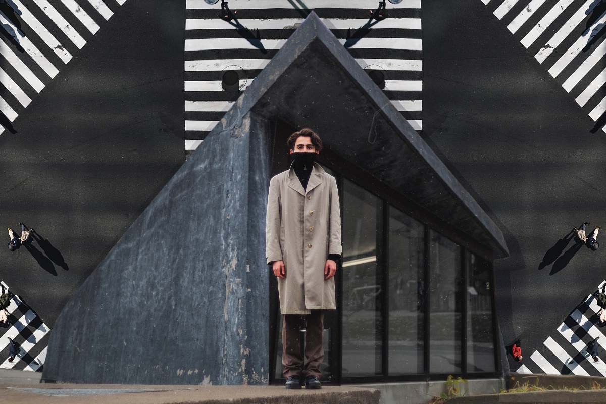 clothing man in gray coat and brown pants standing coat