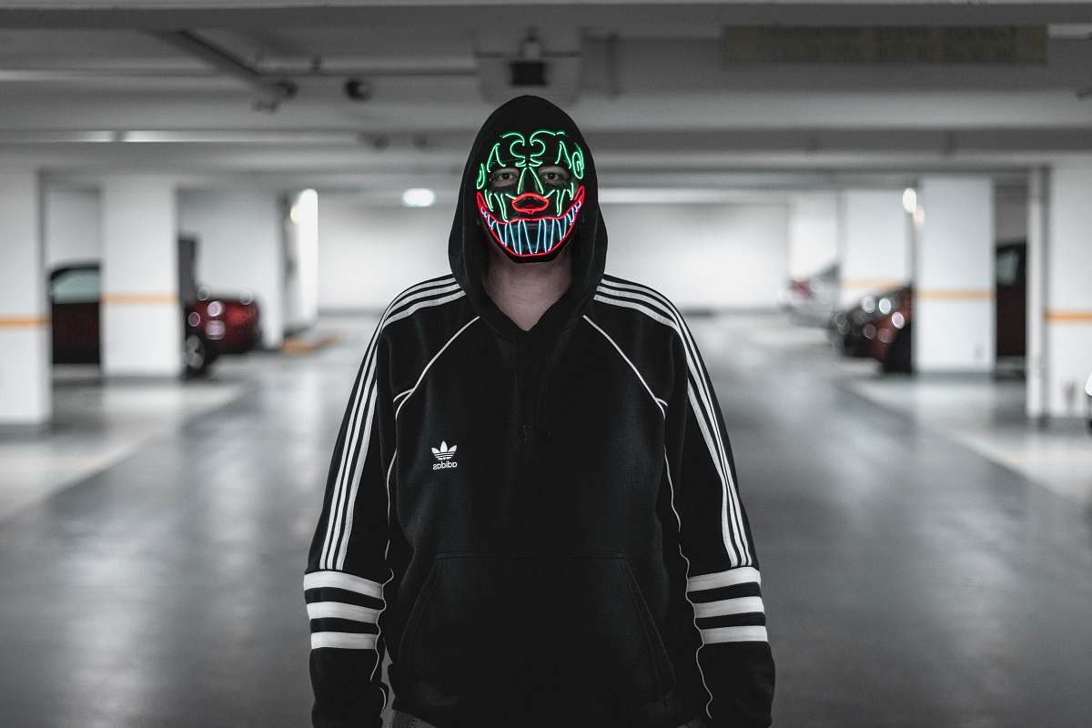 clothing man wearing black and white adidas jacket wearing multicolored mask automobile