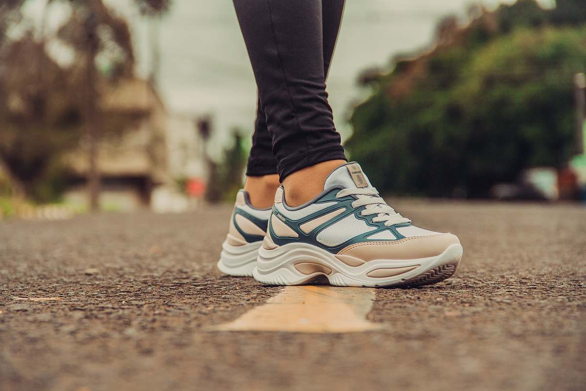 clothing person wearing white-and-gray sneakers footwear