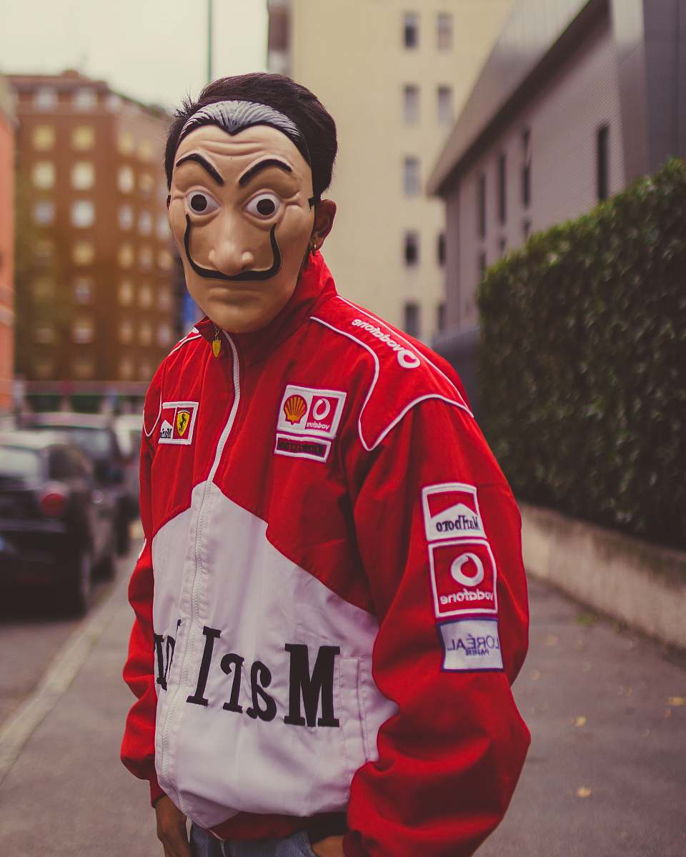 clothing selective focus photography of man wearing mask and red and white jacket human