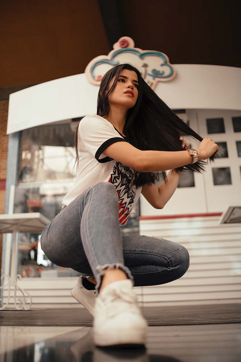 clothing woman in white t-shirt with blue denim jeans with sneakers shoe