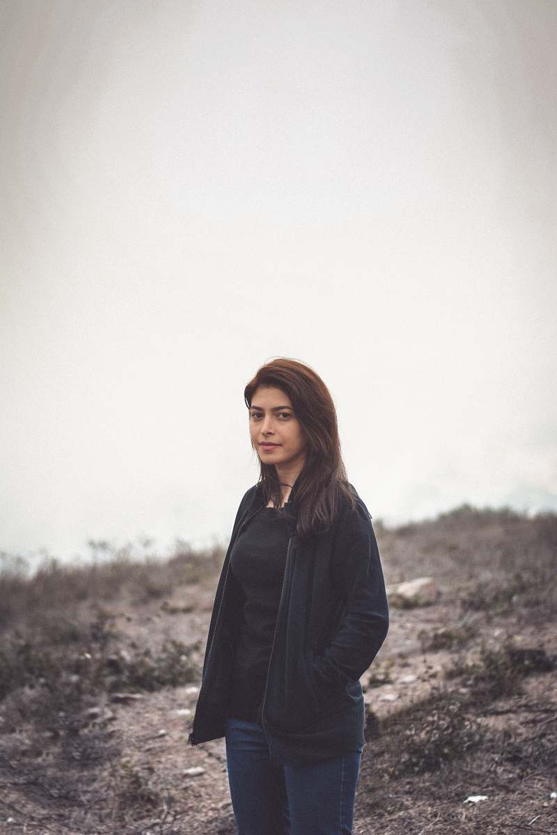 clothing woman standing and smiling during day sleeve