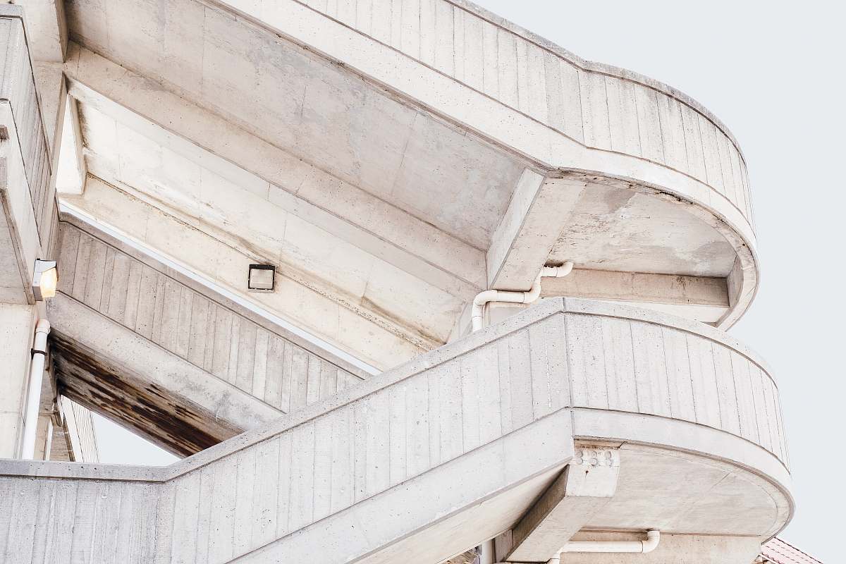 stairwell beige concrete stairs with white skies background stairway