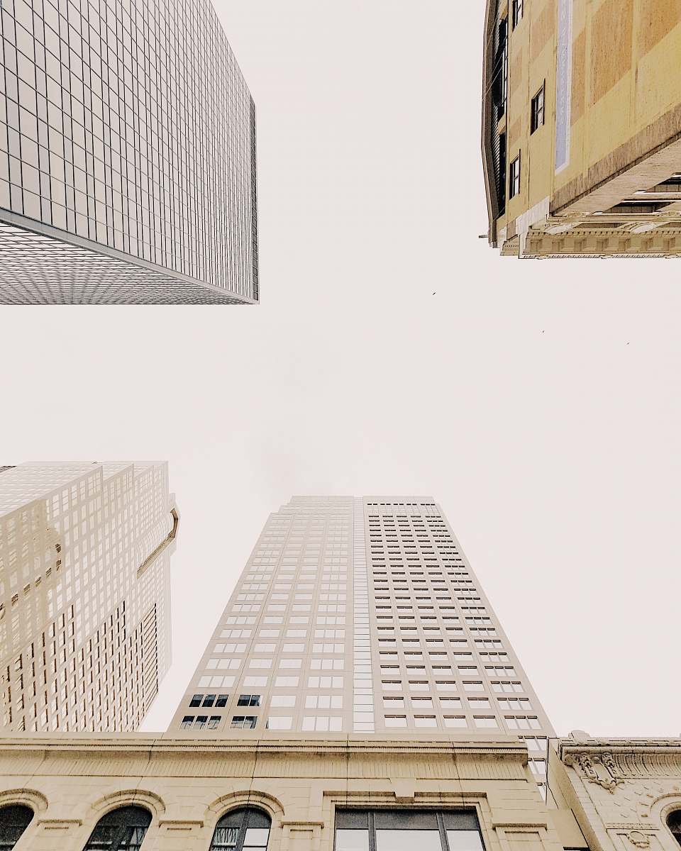 building high-angle photography of gray high-rise building at daytime skyscraper