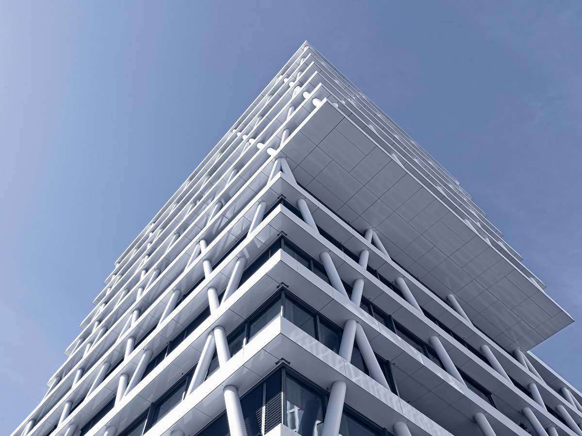 building low-angle photo of white high-rise building skyscraper