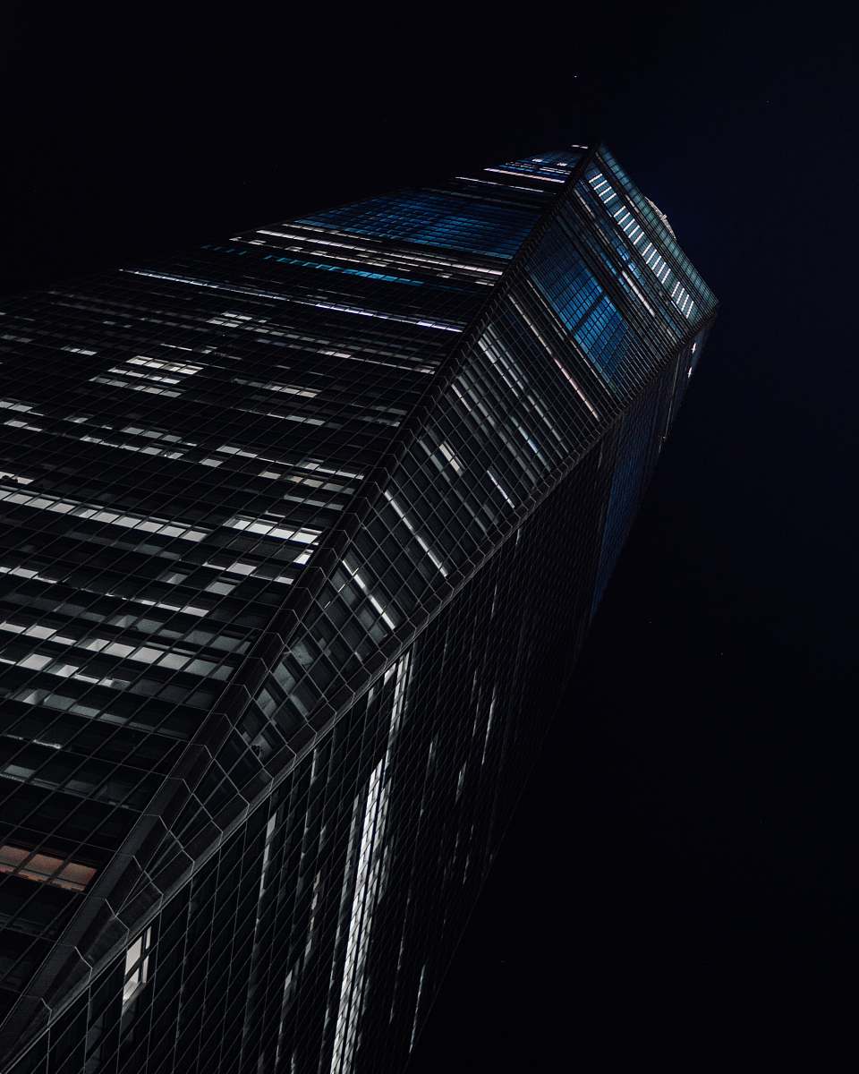 building low-angle photography of high-rise building at nighttime skyscraper