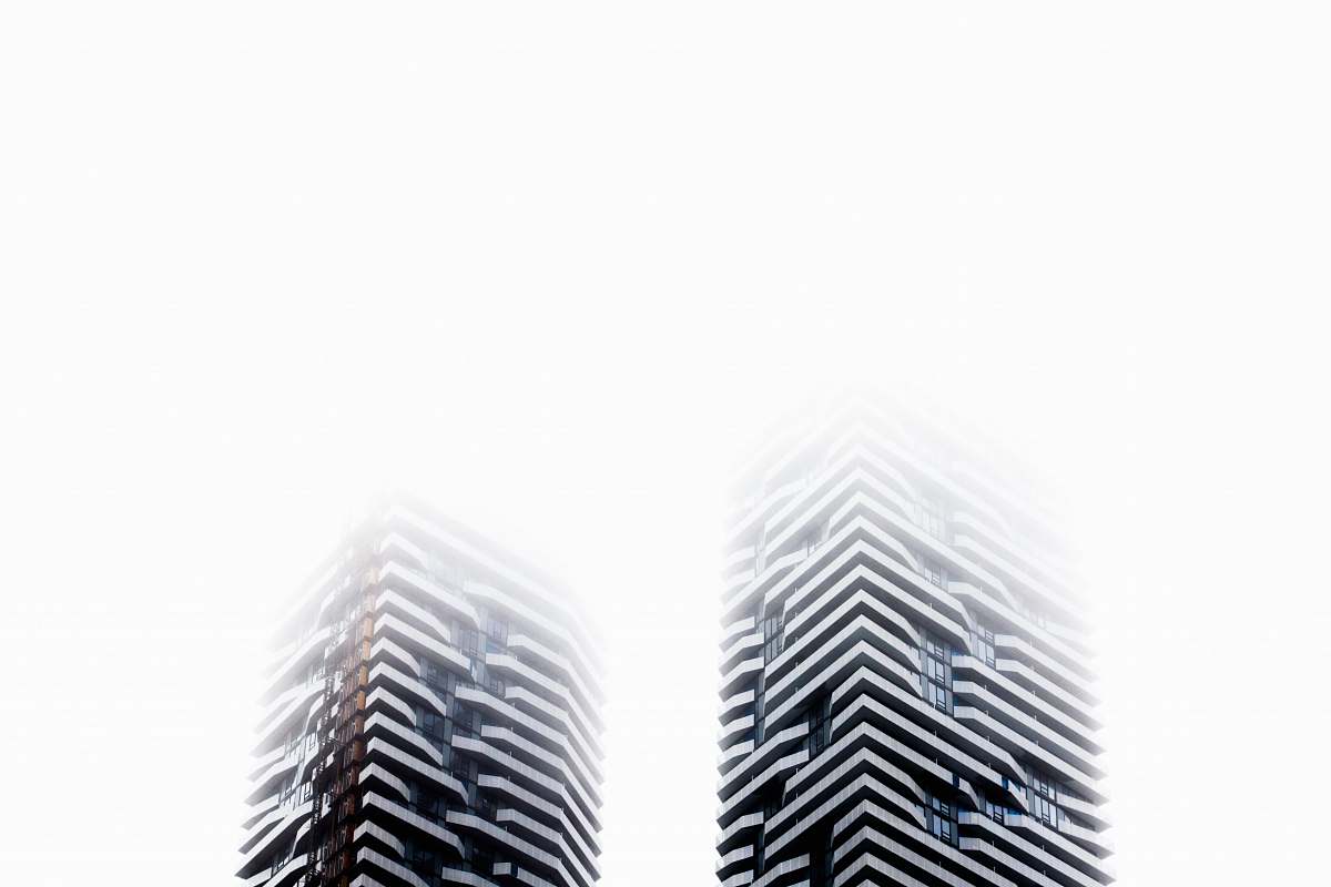 building low angle photography of two high rise buildings skyscraper