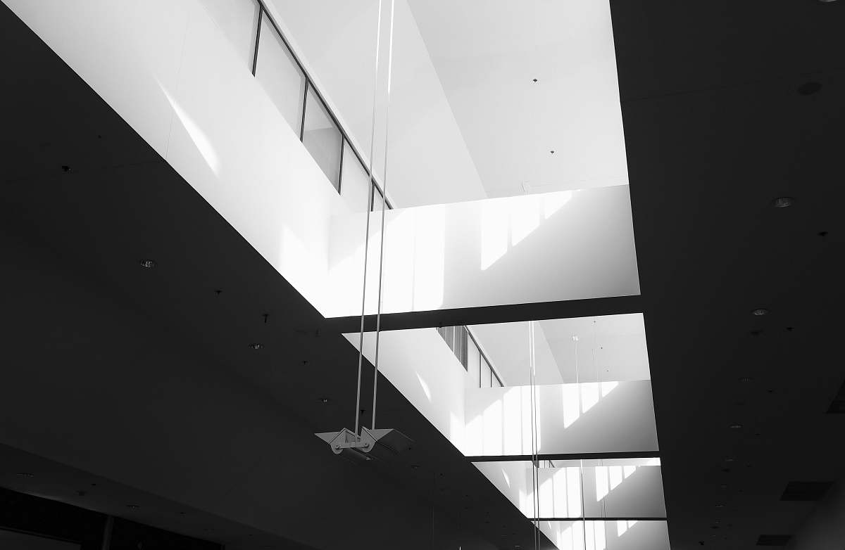 building low angle photography of white painted room interior black-and-white