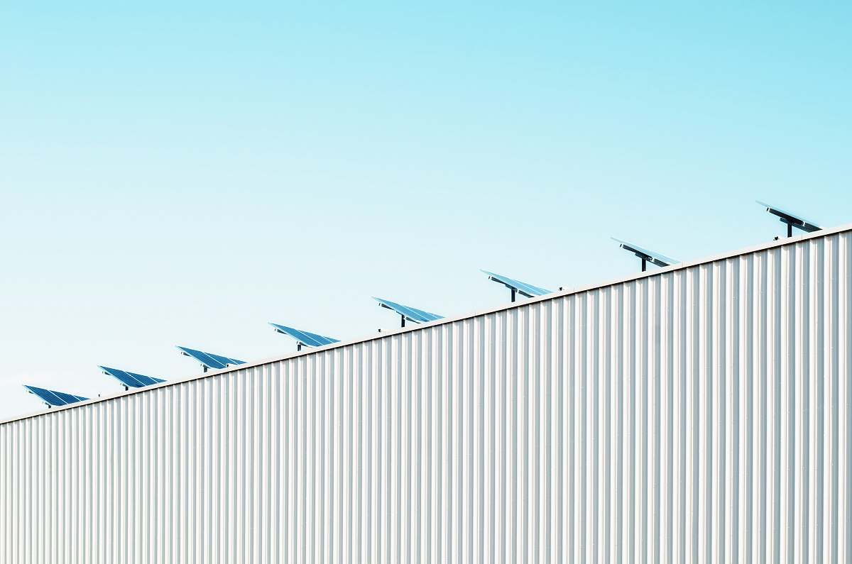 blue parabolic antenna on white roof solar