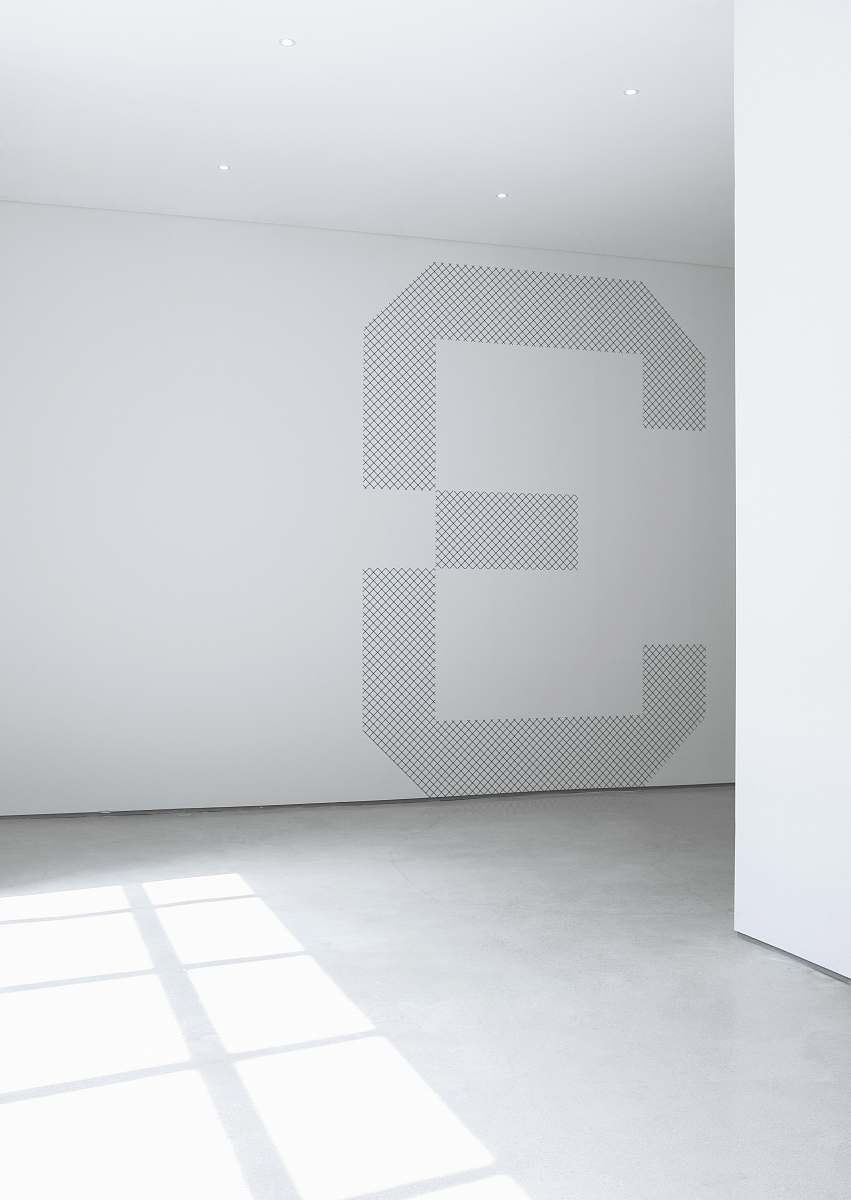 white photo of white concrete wall inside room grey