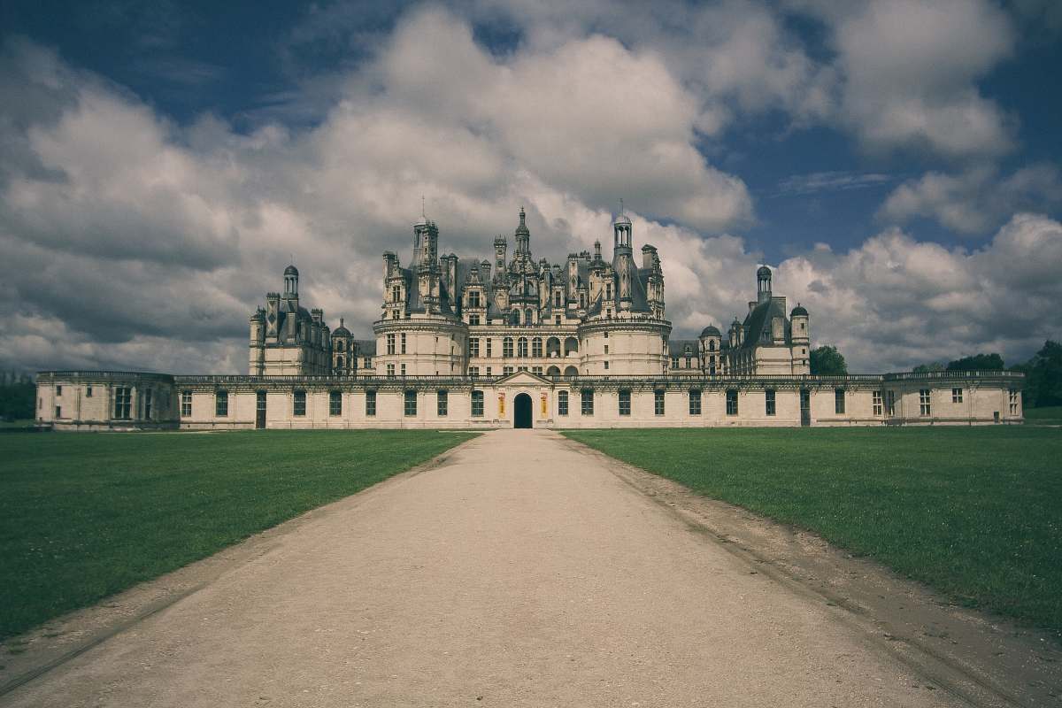castle photography of white mosque and green lawn château de chambord