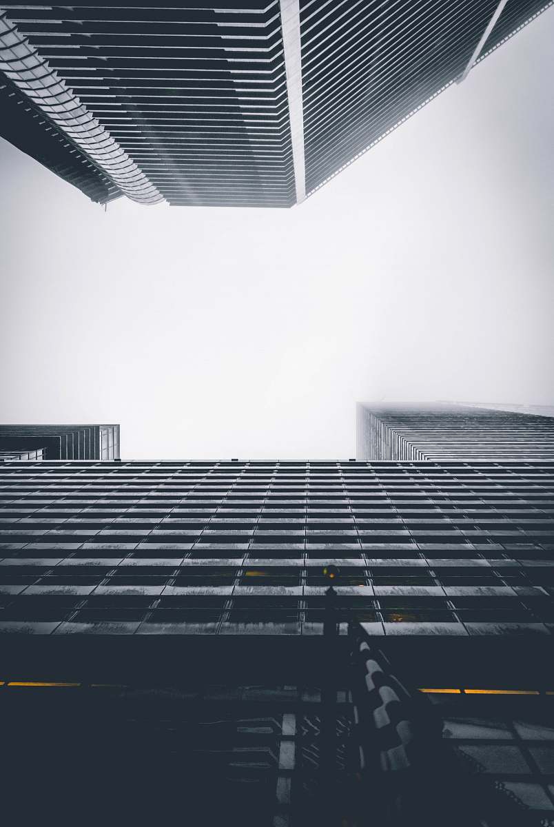 building two buildings under white sky during daytime office building