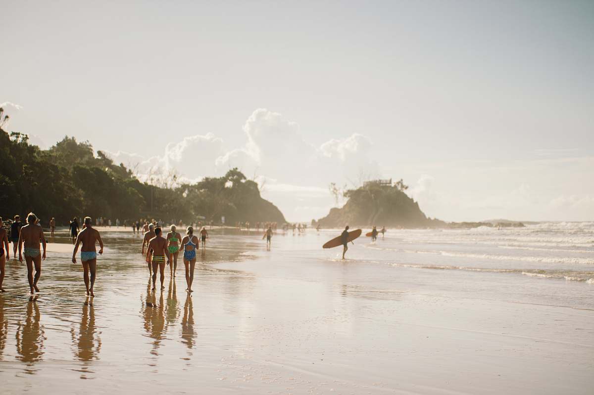 sea people walking along beach during daytime coast