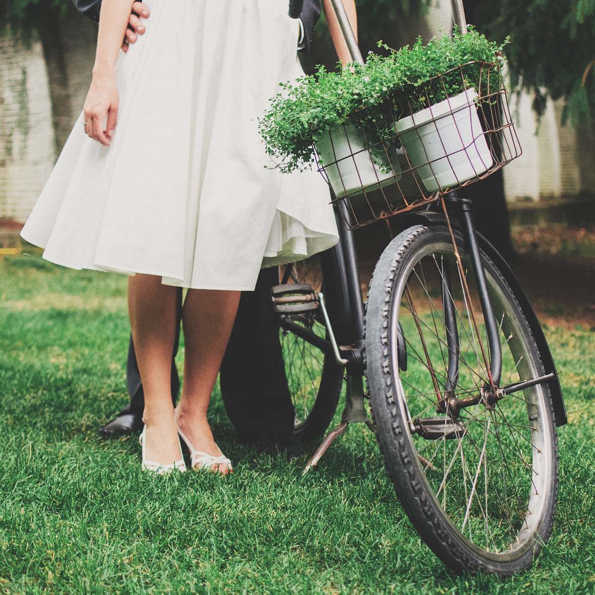 bicycle person standing besides black bicycle wedding