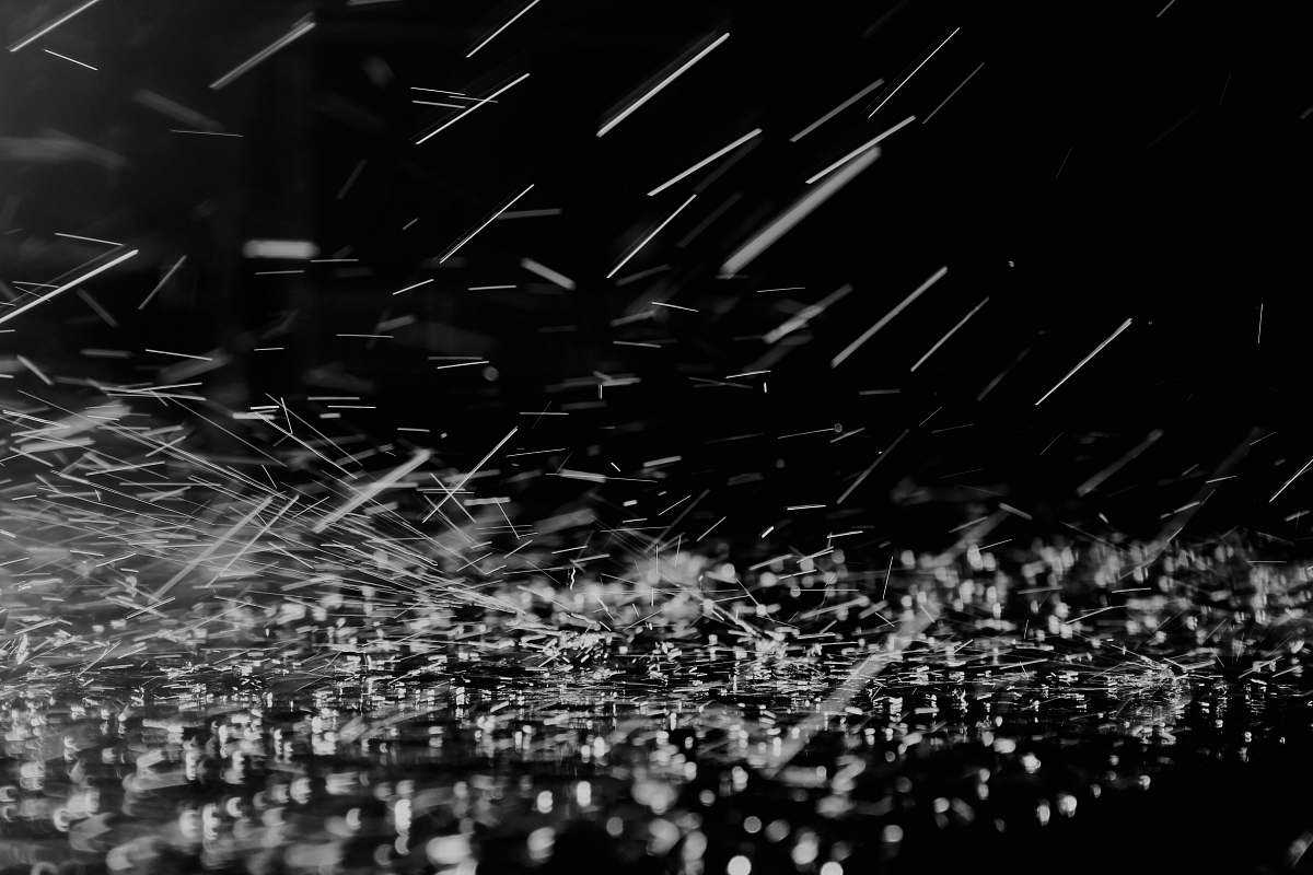 Experience the serene beauty of a black and white photograph capturing delicate snowflakes cascading from a grey sky. This striking outdoor image evokes a feeling of calm and tranquility, making it perfect for winter-themed projects, editorial use, or as a stunning backdrop for your creative work. Ideal for those looking to add a touch of elegance and simplicity to their designs.