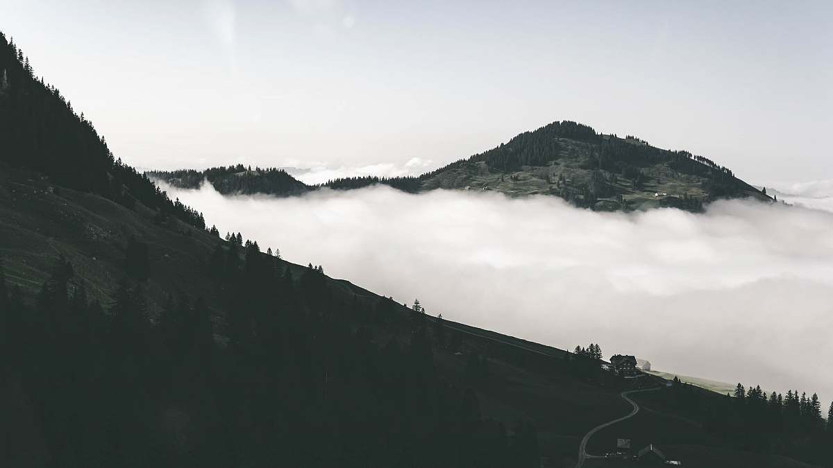 nature aerial photo of mountain and sea of clouds outdoors