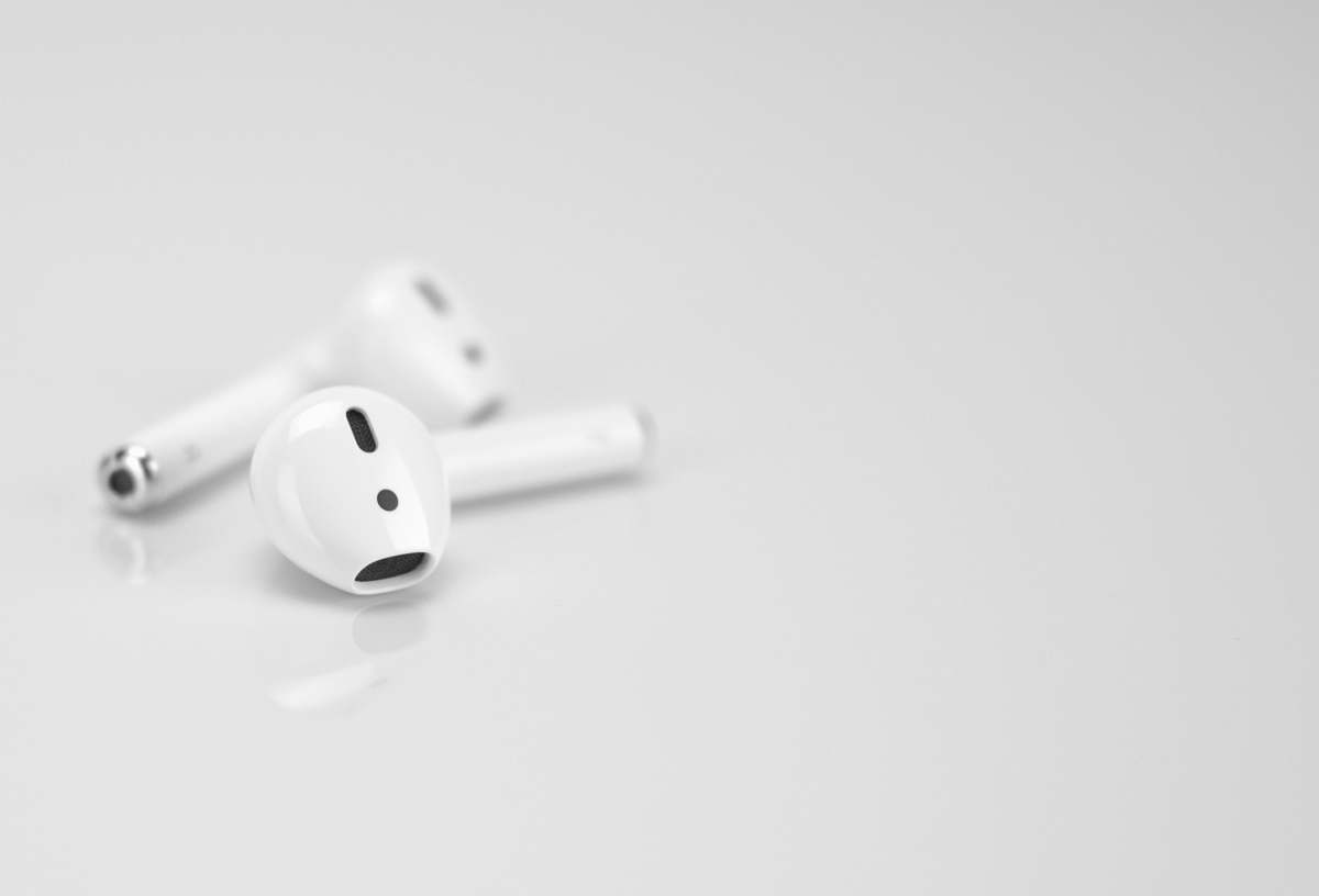 grey Apple AirPods on white surface game