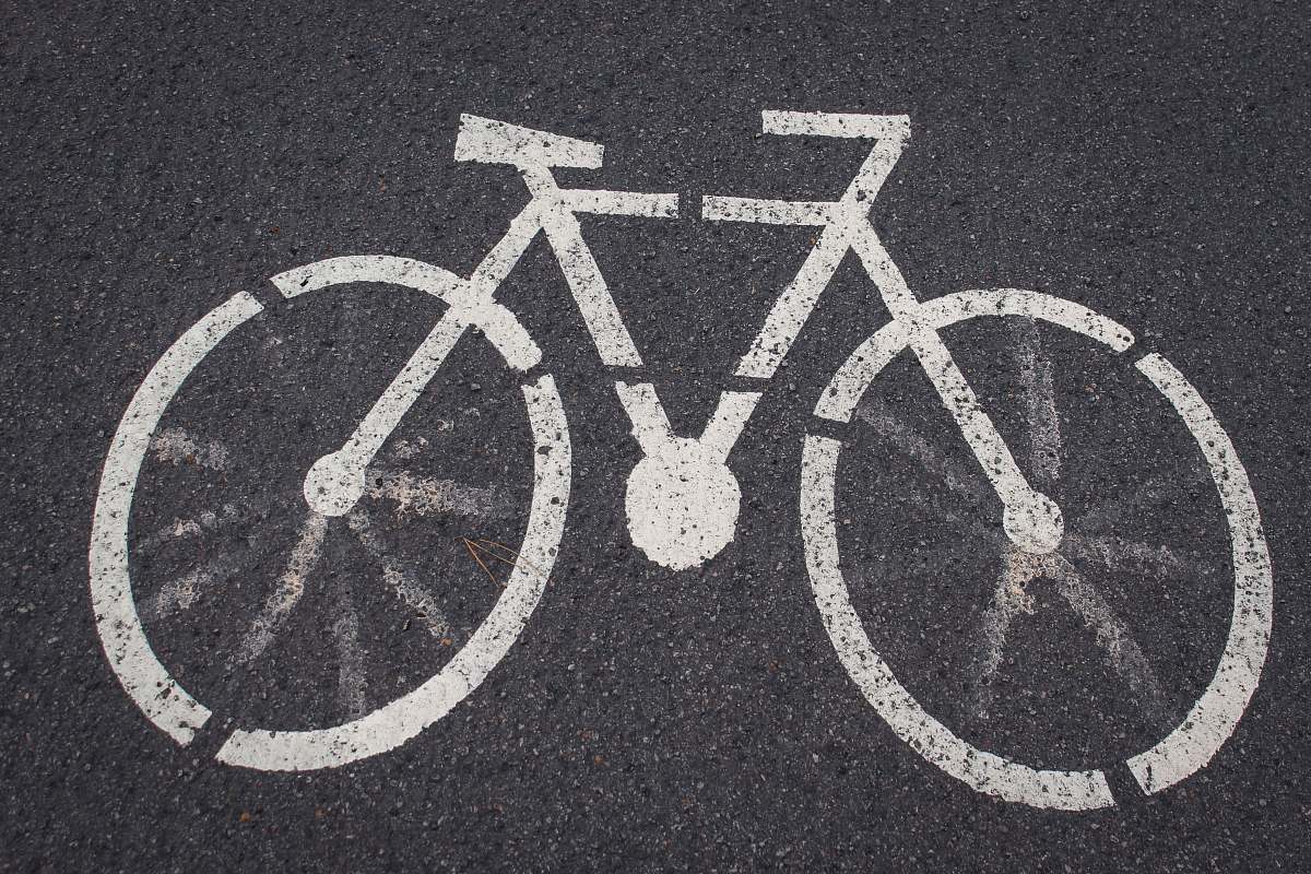 grey bicycle lane road signage tarmac