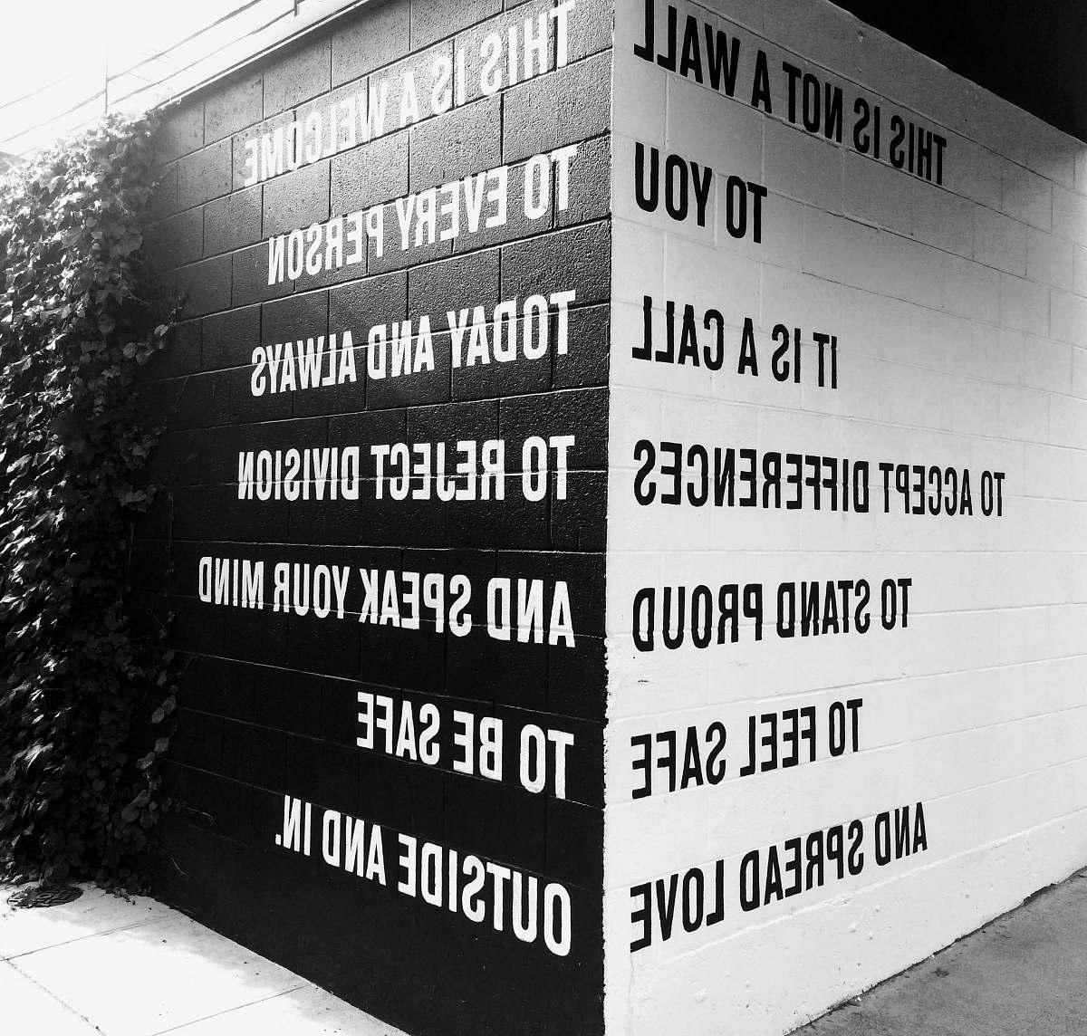 word black and white text on wall portland