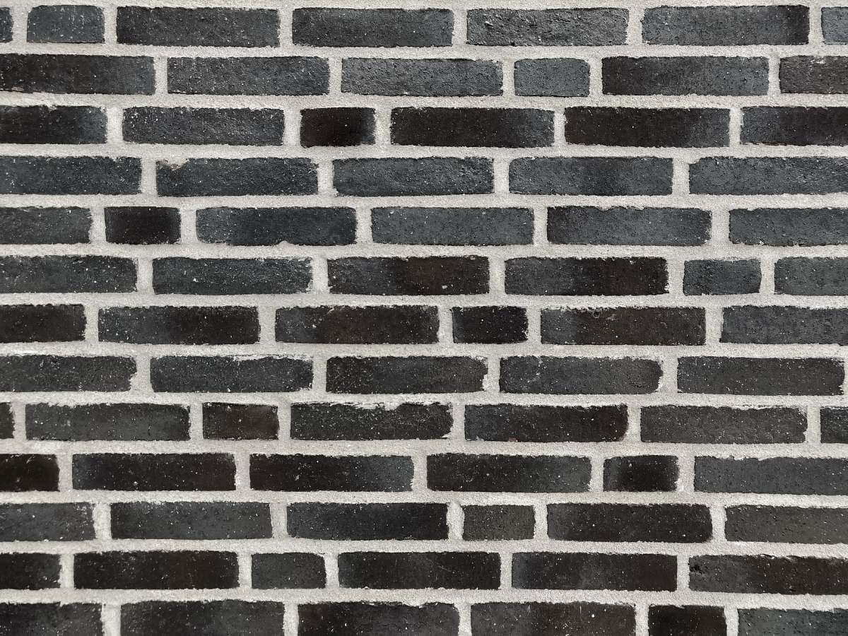 rug black concrete brick stone wall