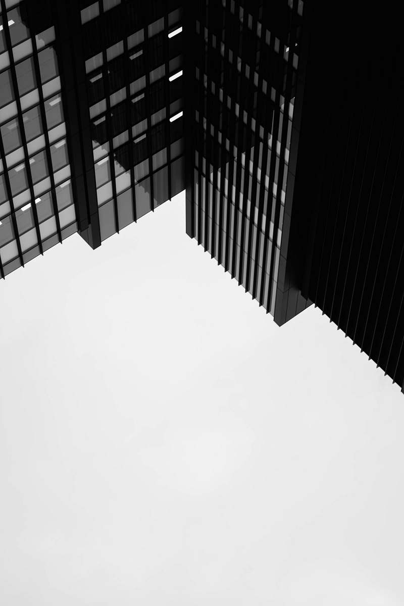 building black concrete building during daytime city