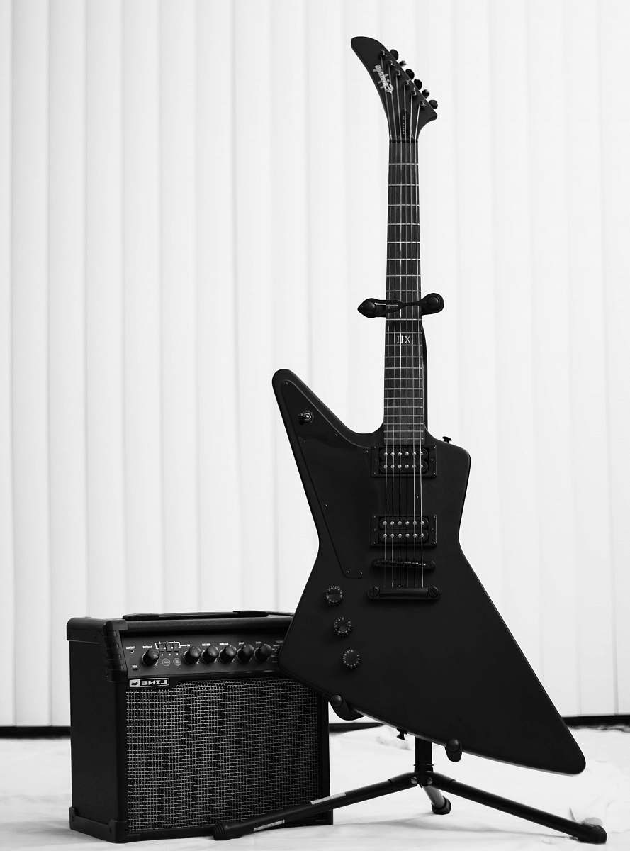 guitar black electric guitar and amplifier leisure activities