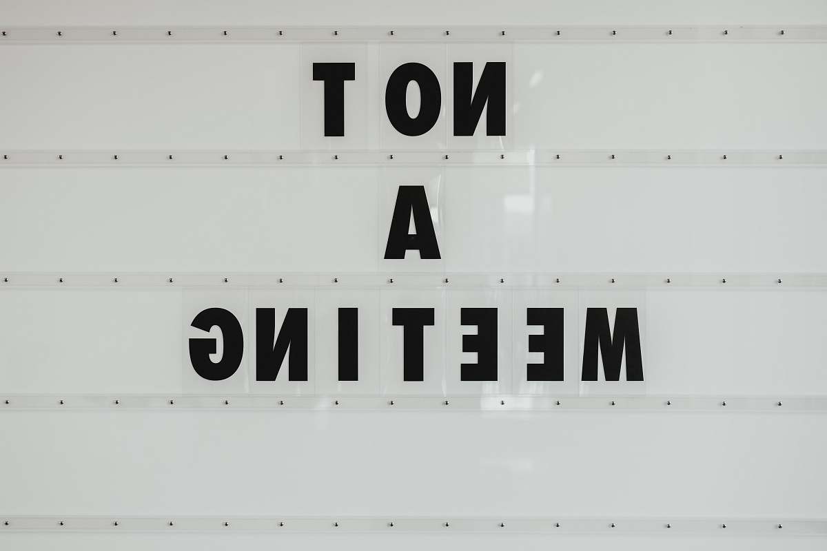 black black note a meeting sign on wall sign