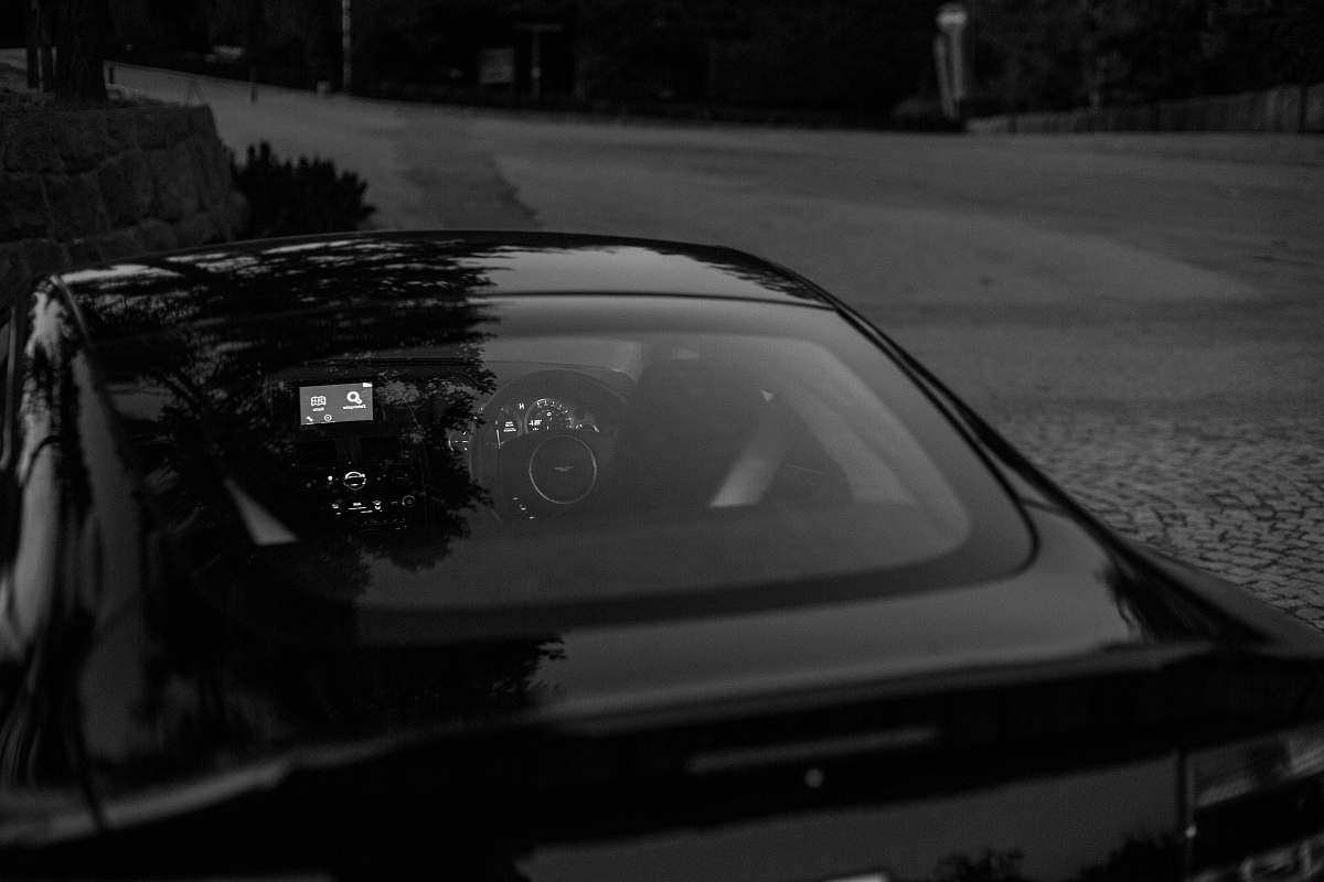 car black vehicle parking near road automobile
