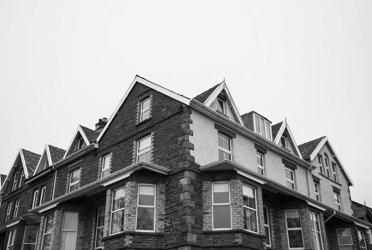 building brown and white building during daytime housing