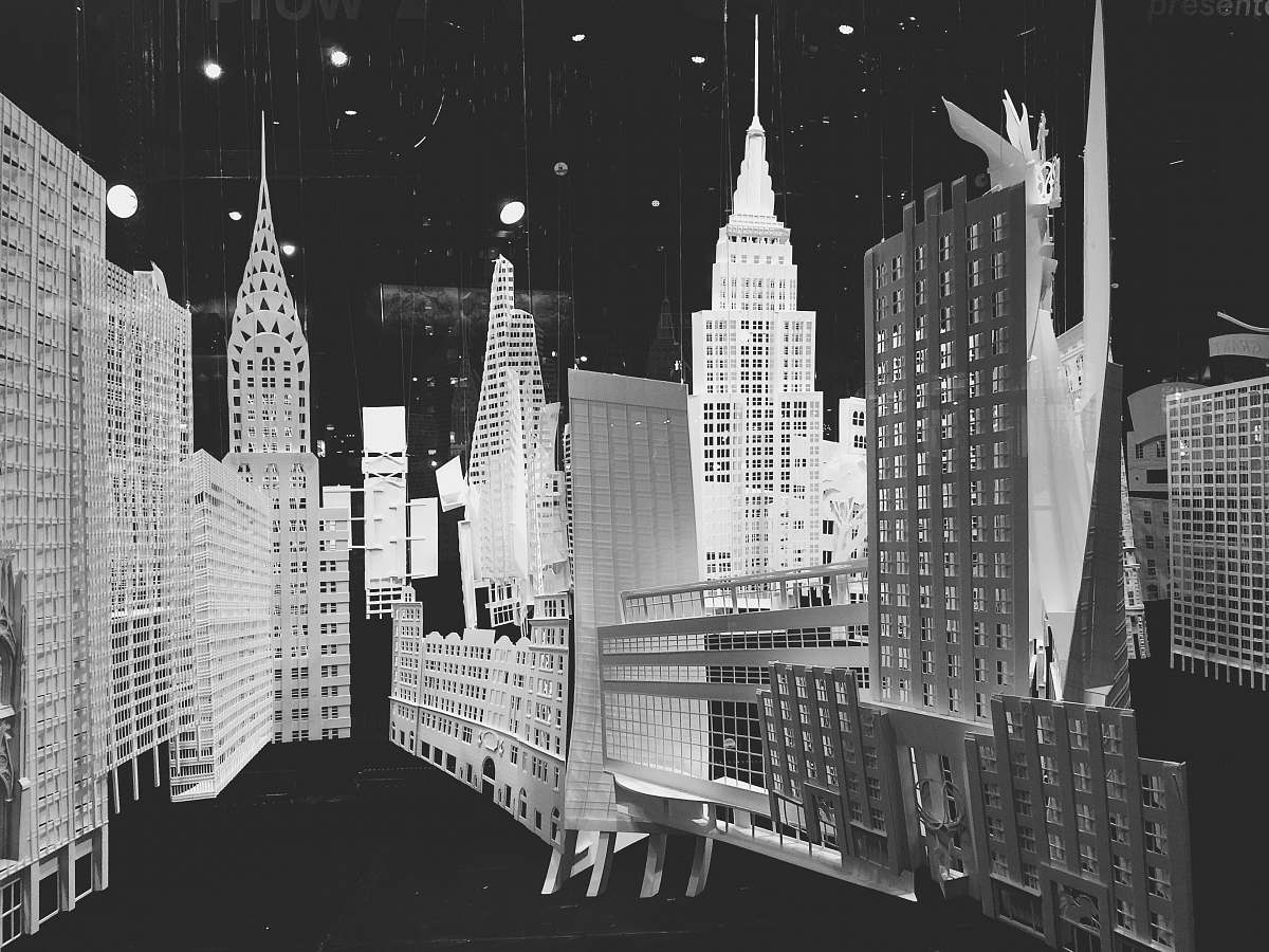 grey city buildings in grayscale photography city