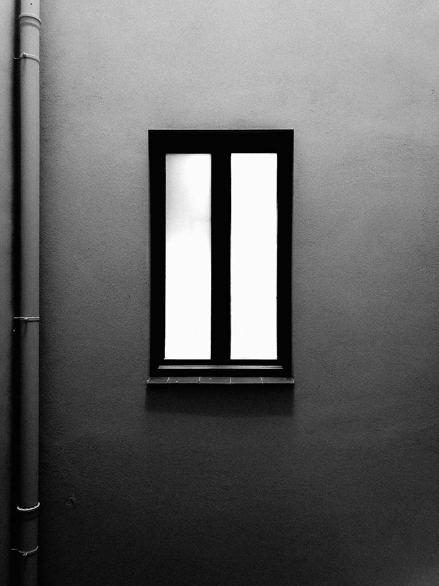 barcelona closed black framed window near wall spain