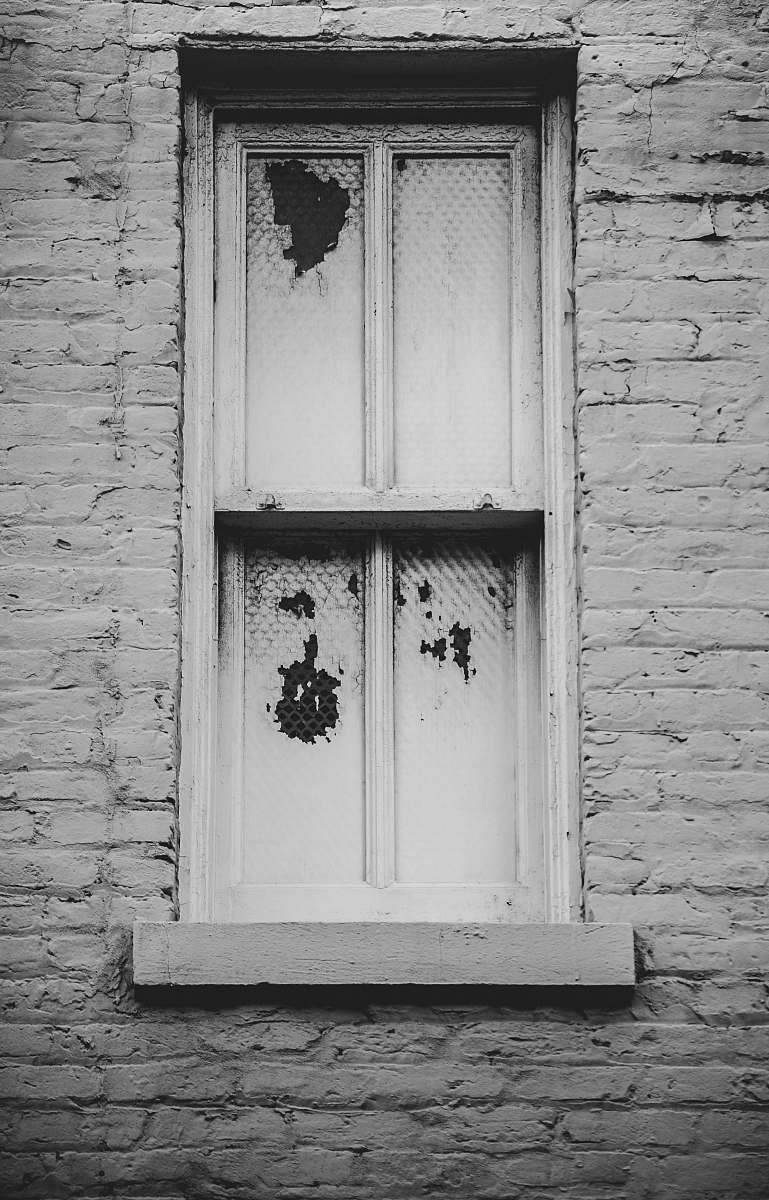 brick closed white wooden window window