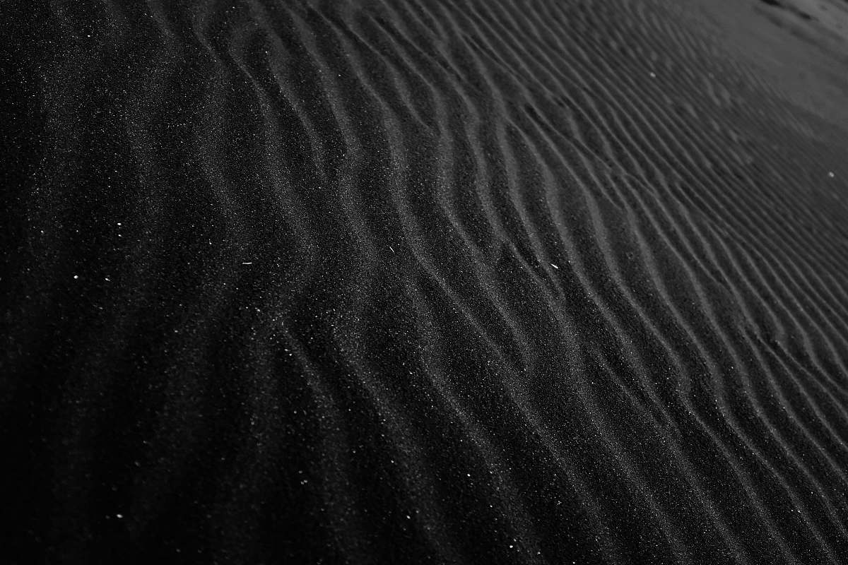sand closeup photo of black sand outdoors