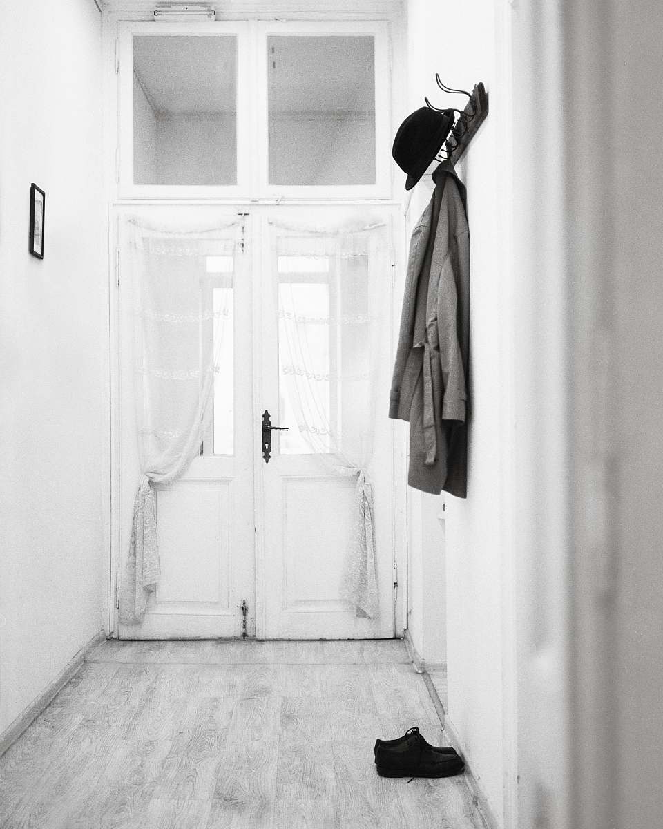 coat coat hanged on wall hooks clothing