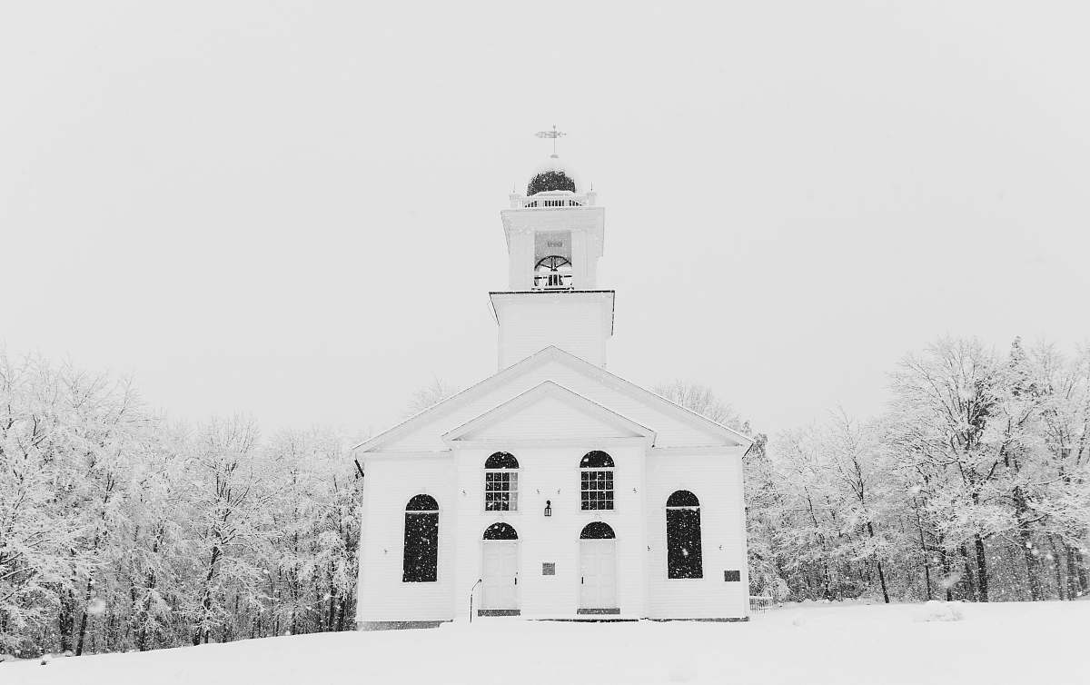 architecture concrete building surrounded with snow covered trees building