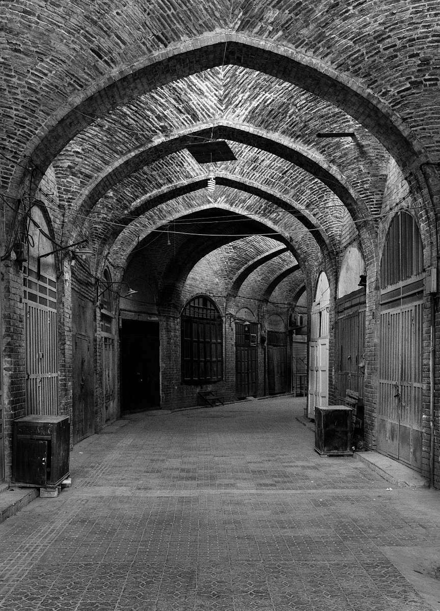 corridor empty hallway grayscale photo crypt