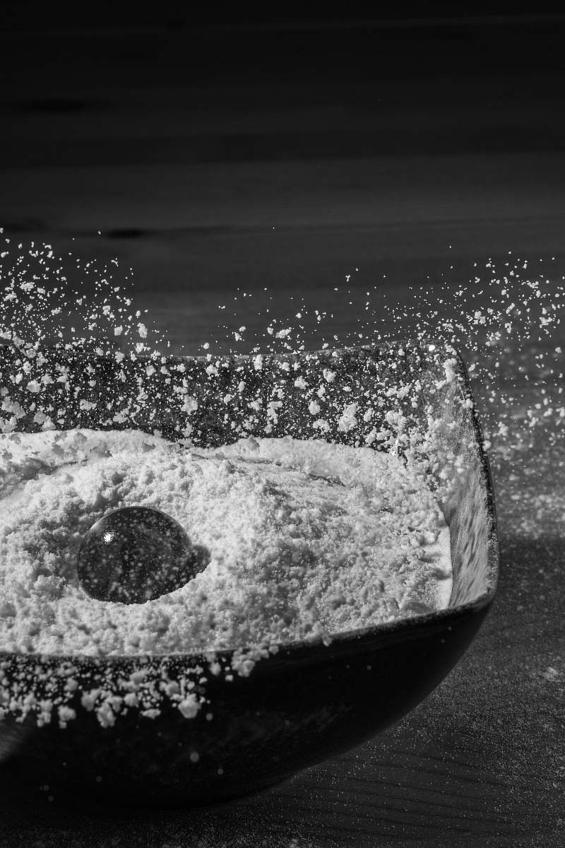 grey glass bowl drops in bowl of flour flour