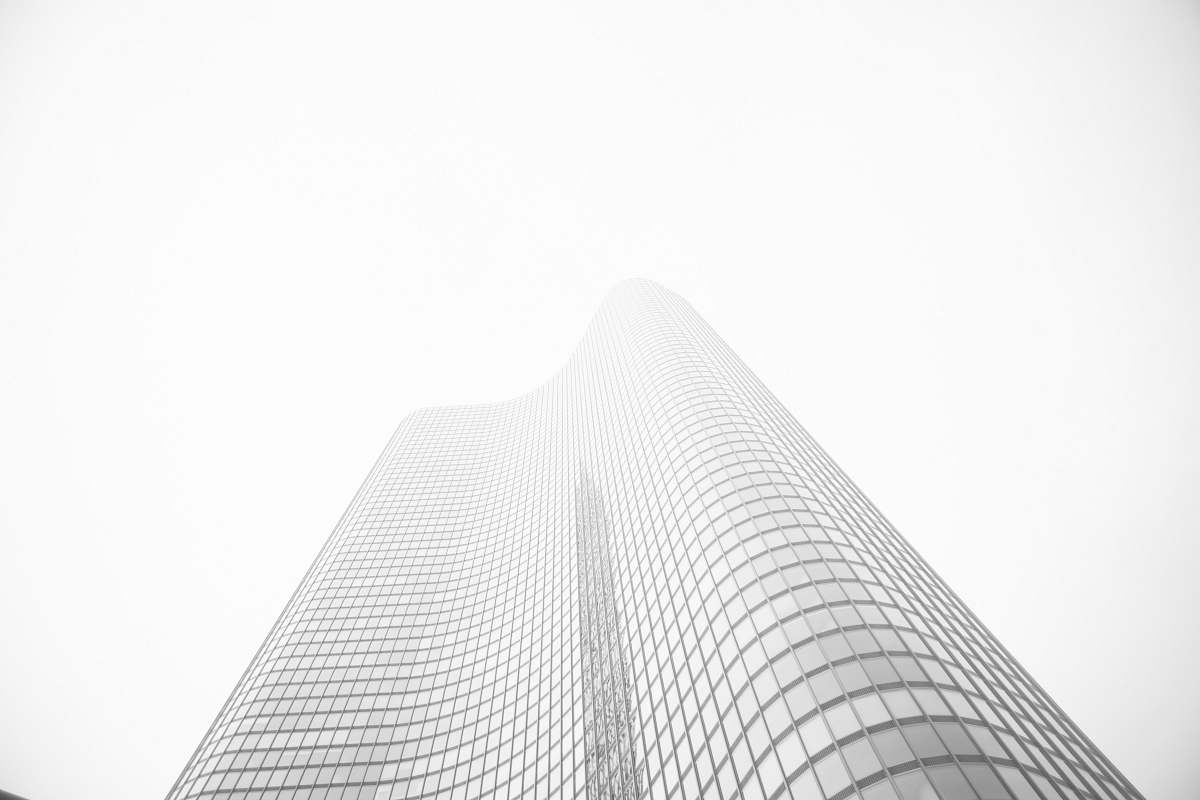 grey glass building under gray sky during daytime architecture