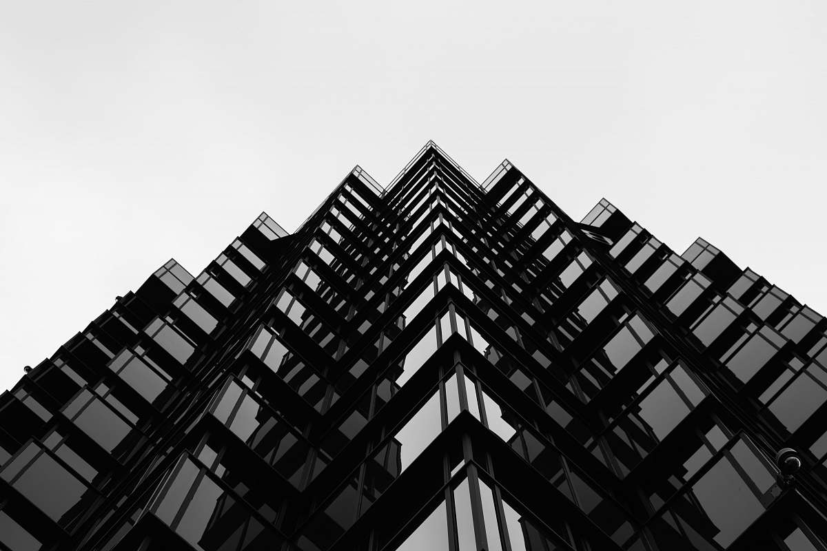 architecture glass building under white sky during daytime skyscraper