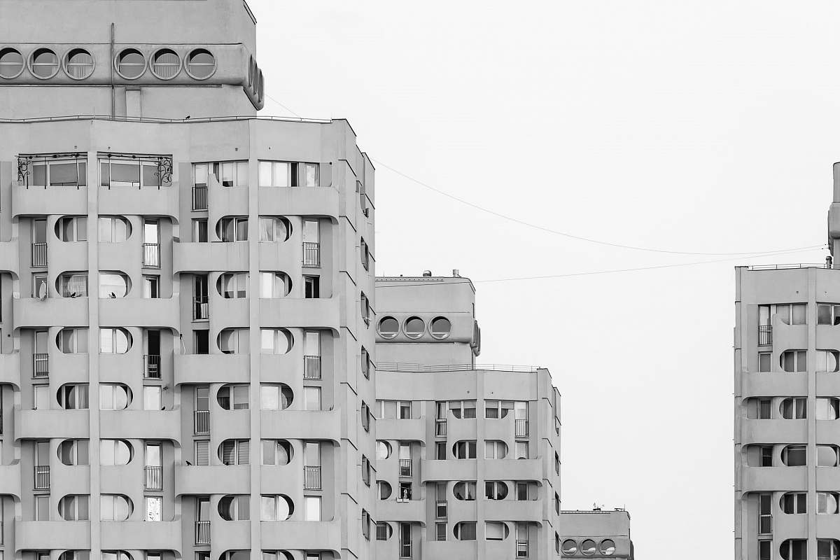 city gray concrete building at daytime urban