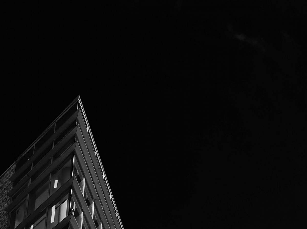 building gray concrete building under night sky architecture
