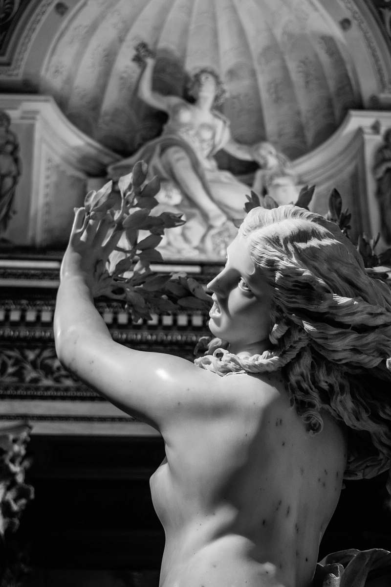 rome gray stone statue of a woman italy